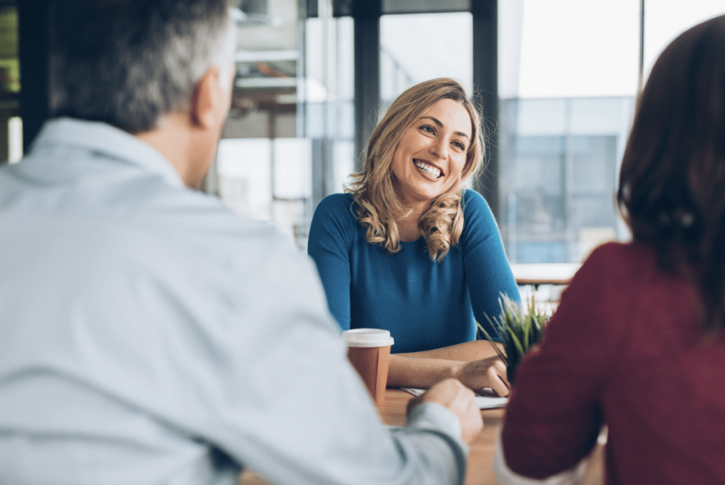 Insurance agent smiling at clients